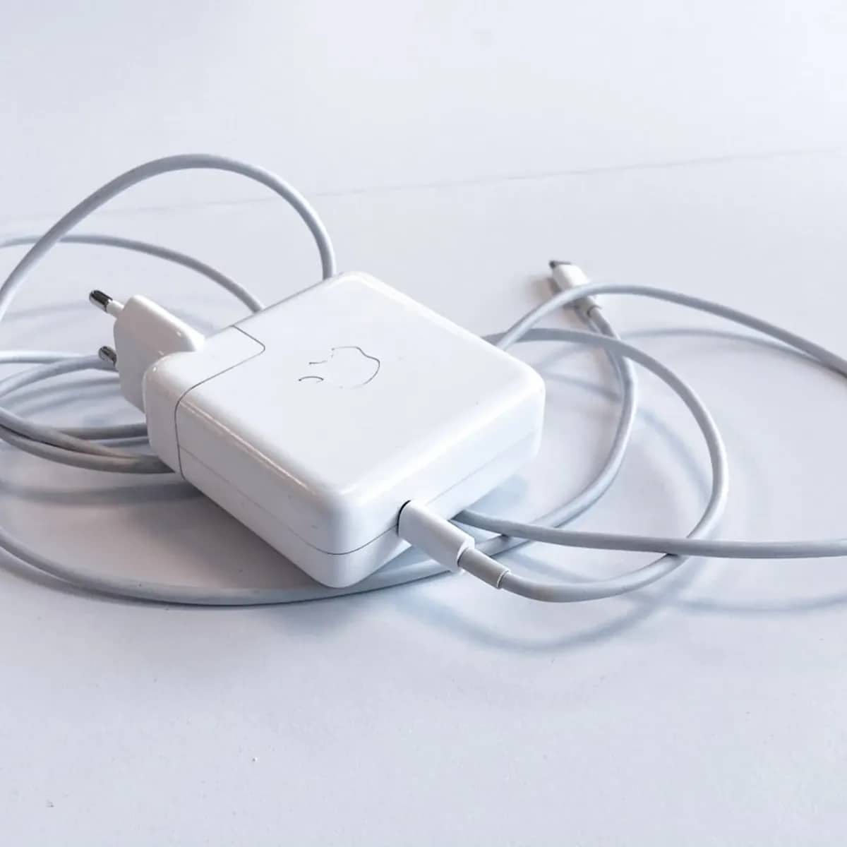 A compact wall charger beside a braided USB-C cable