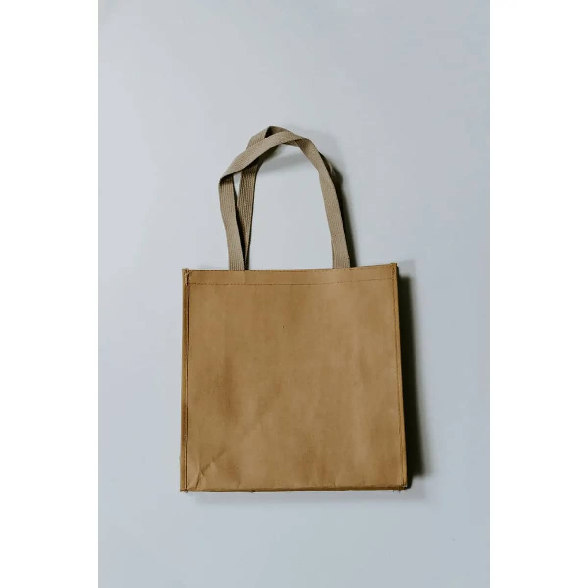 A padded fabric laptop sleeve, zipped closed