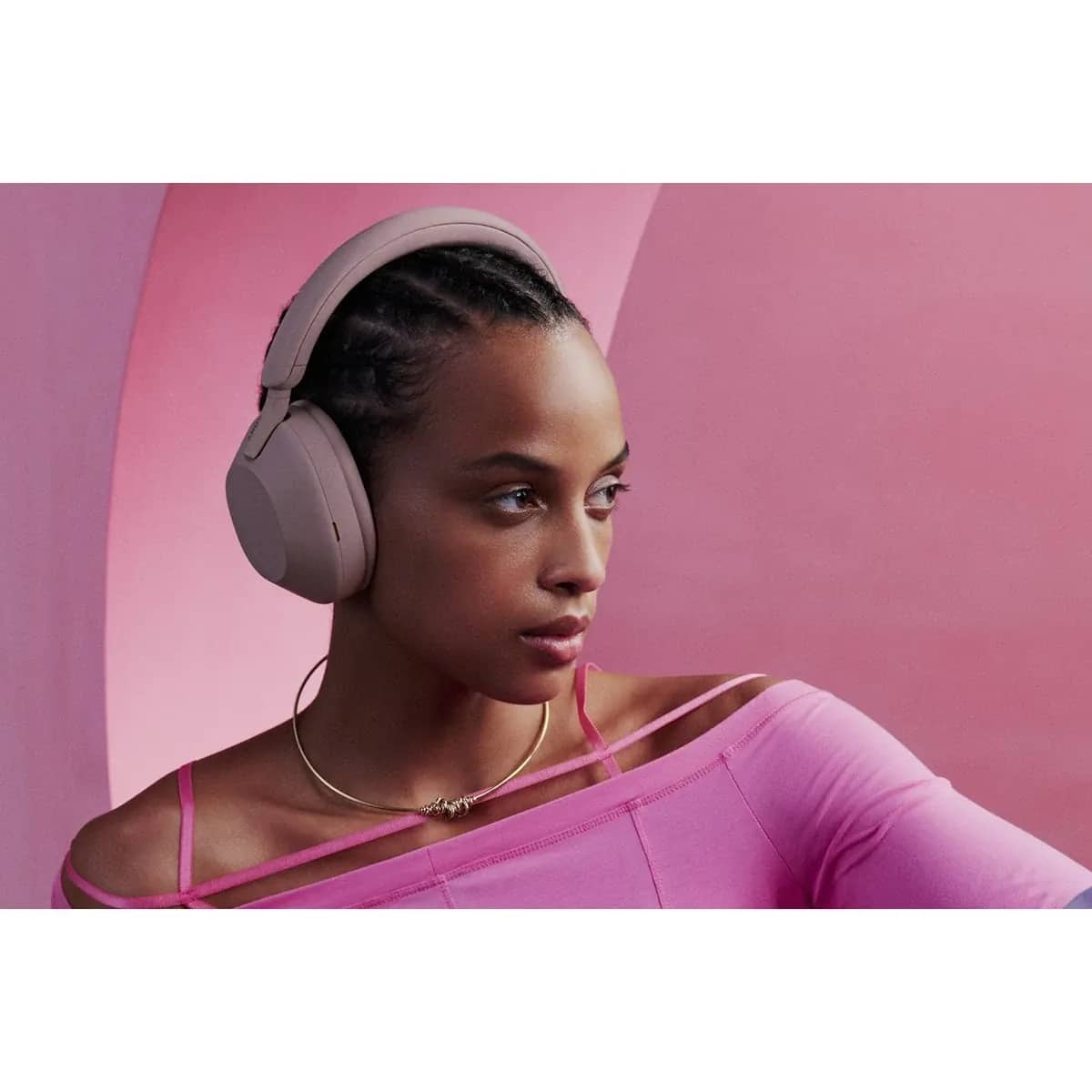 A pair of over-ear Sony headphones beside their folding case