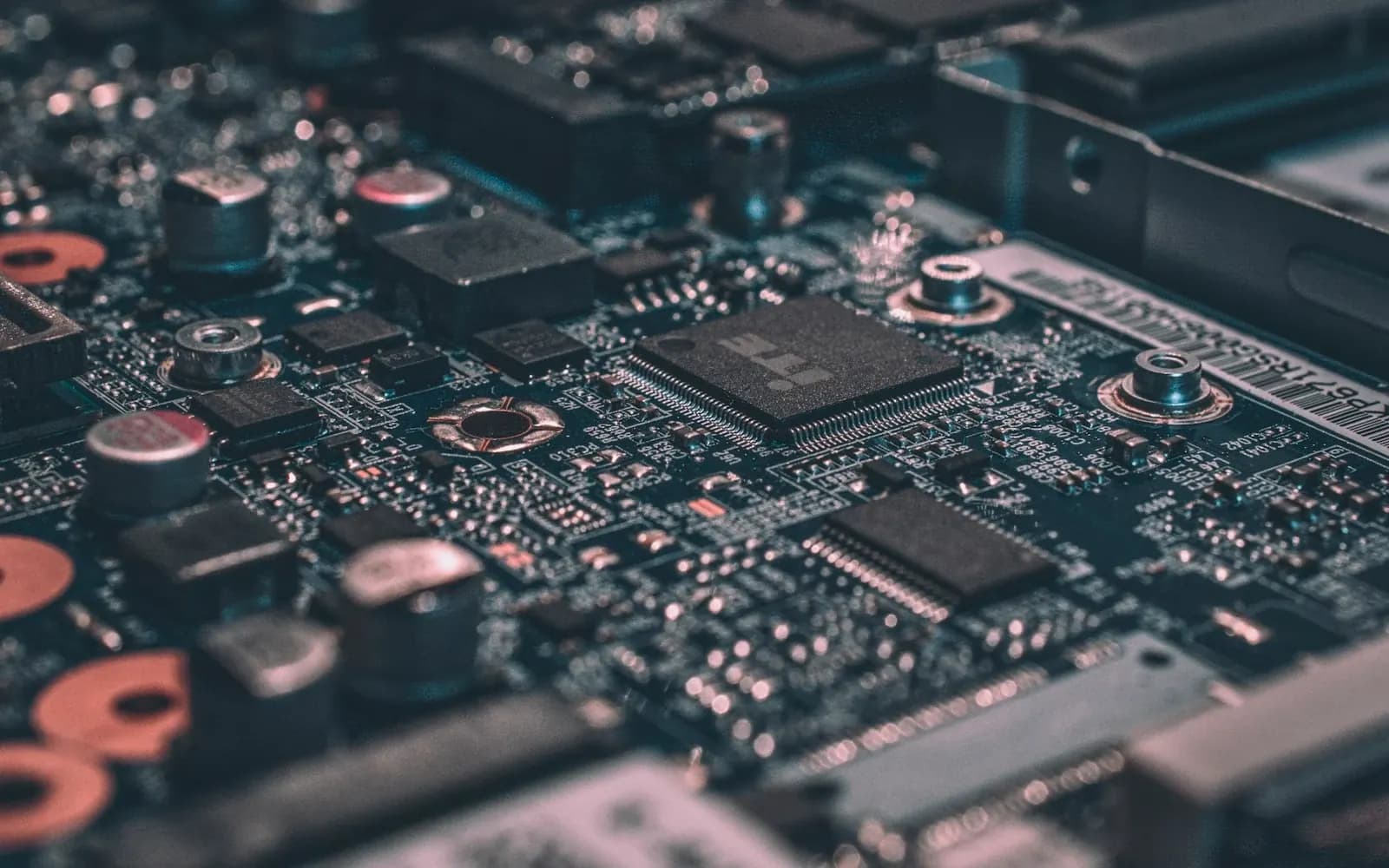 A circuit board being cleaned with a fine brush